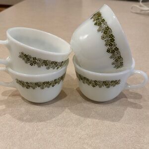 Four vintage Pyrex Spring Blossom coffee cups.